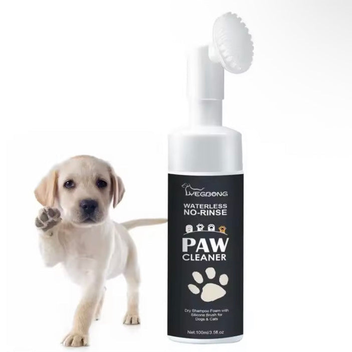 100 mL Paw Cleaner foam bottle with brush, shown beside a puppy